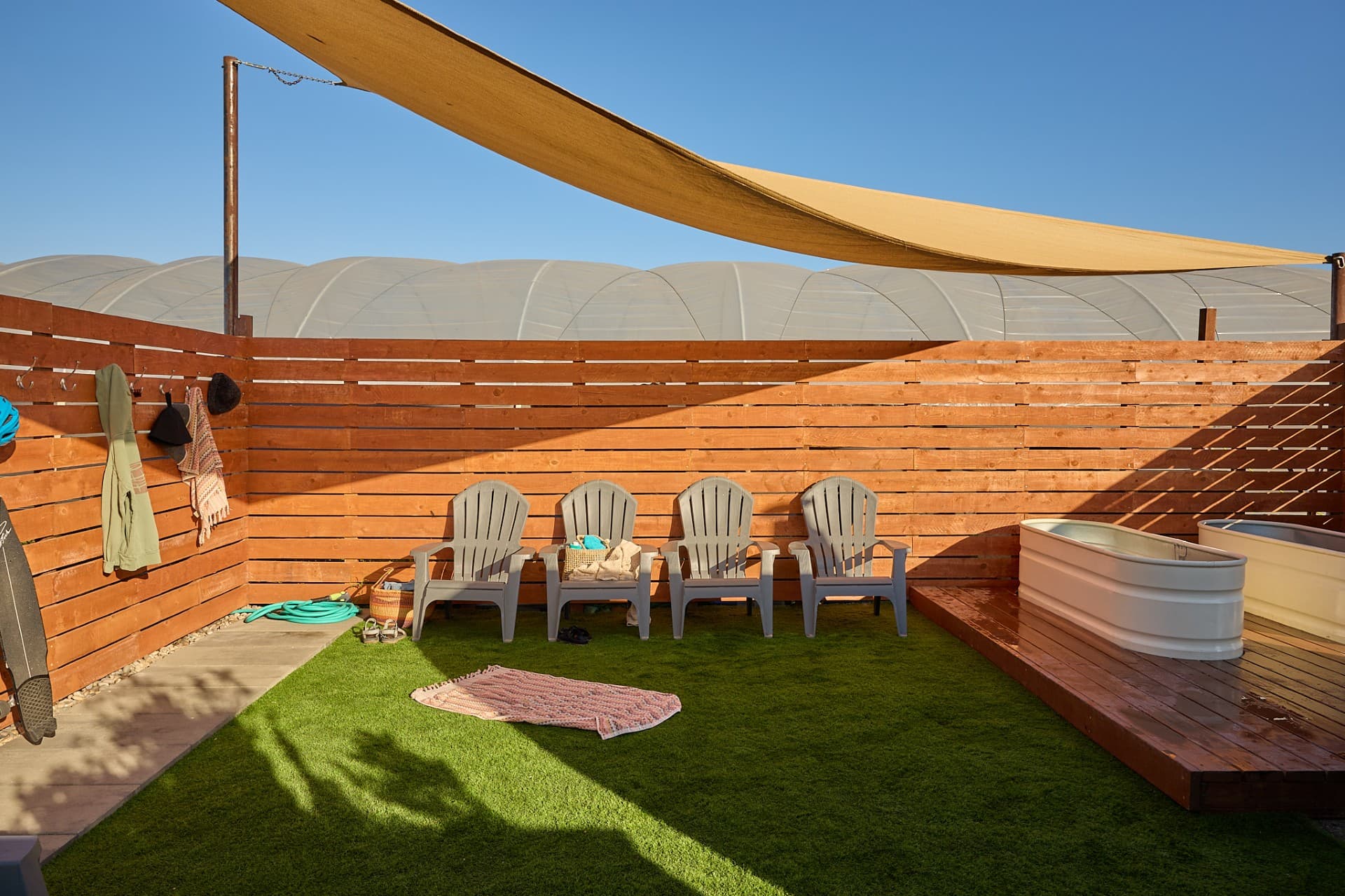 Lounge chairs and two cold plunge tubs at SLO Ranch Farms